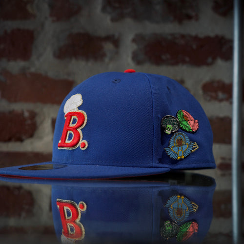 Beignet boys chef logo baseball cap with red 'B' logo and various SPY BOY and space broccoli pins
