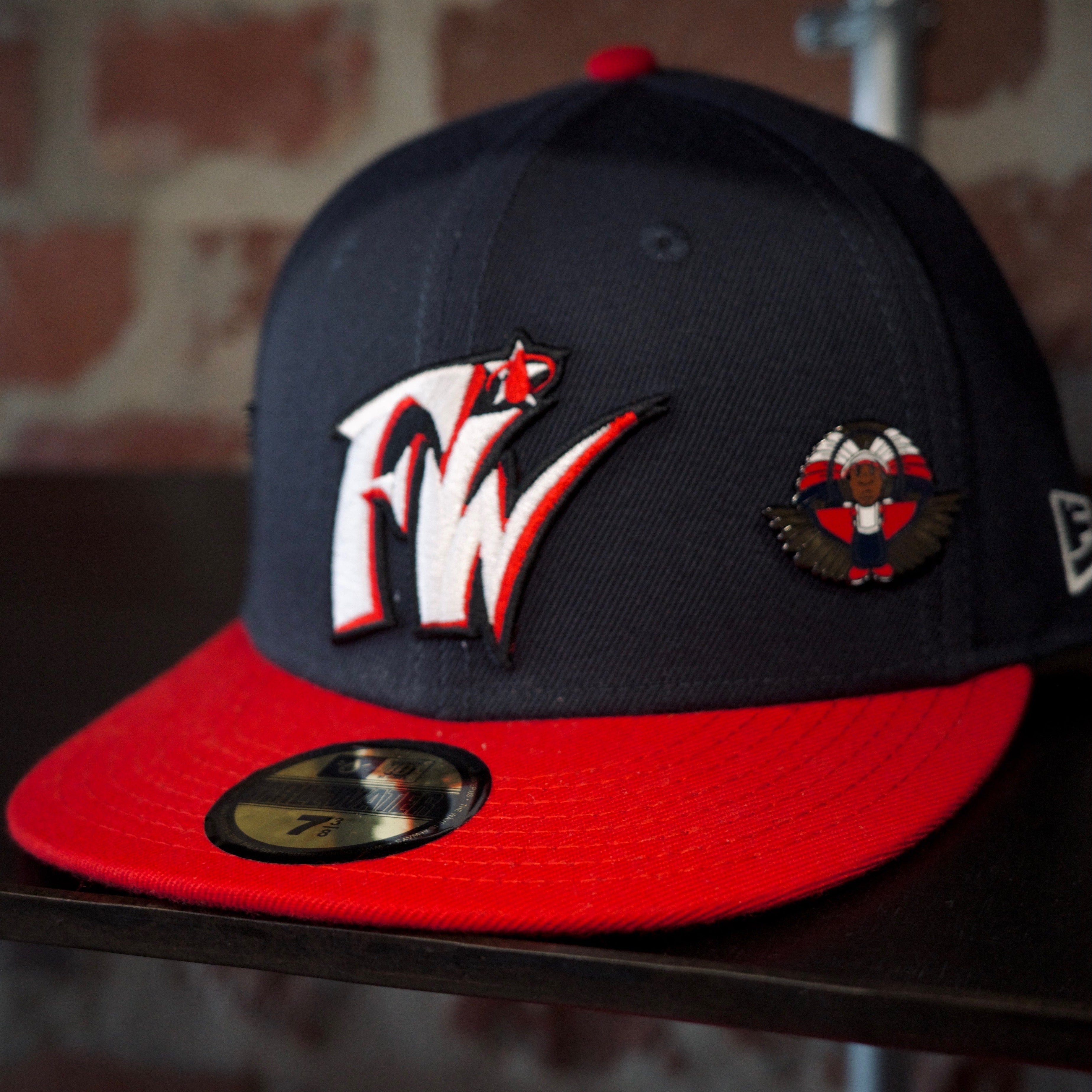 Navy and red free water cap with SPY BOY pin