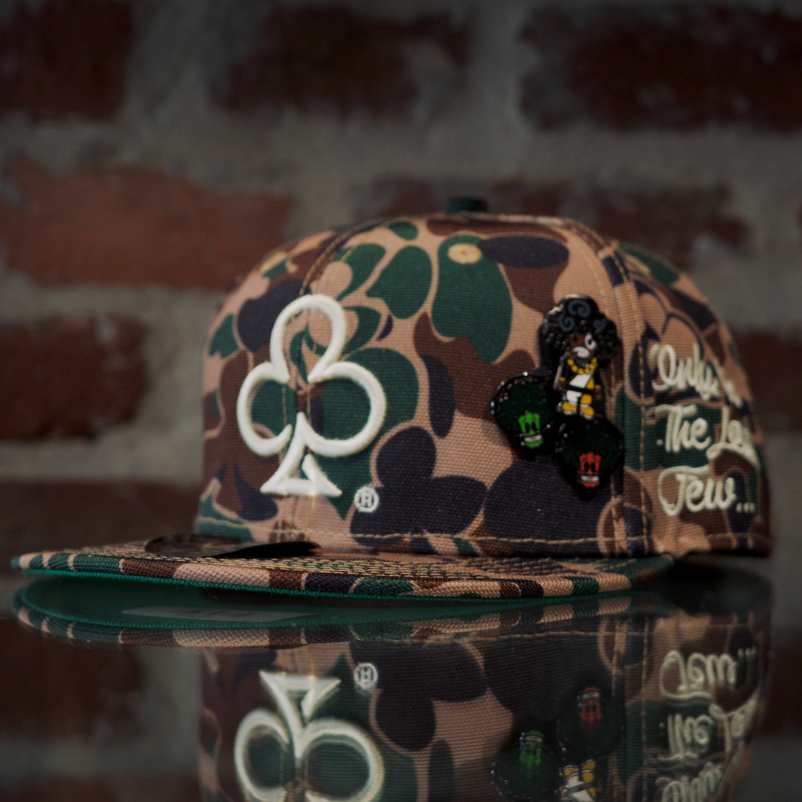Loyalty club camo snapback cap with logo and various SPY BOY and space broccoli pins