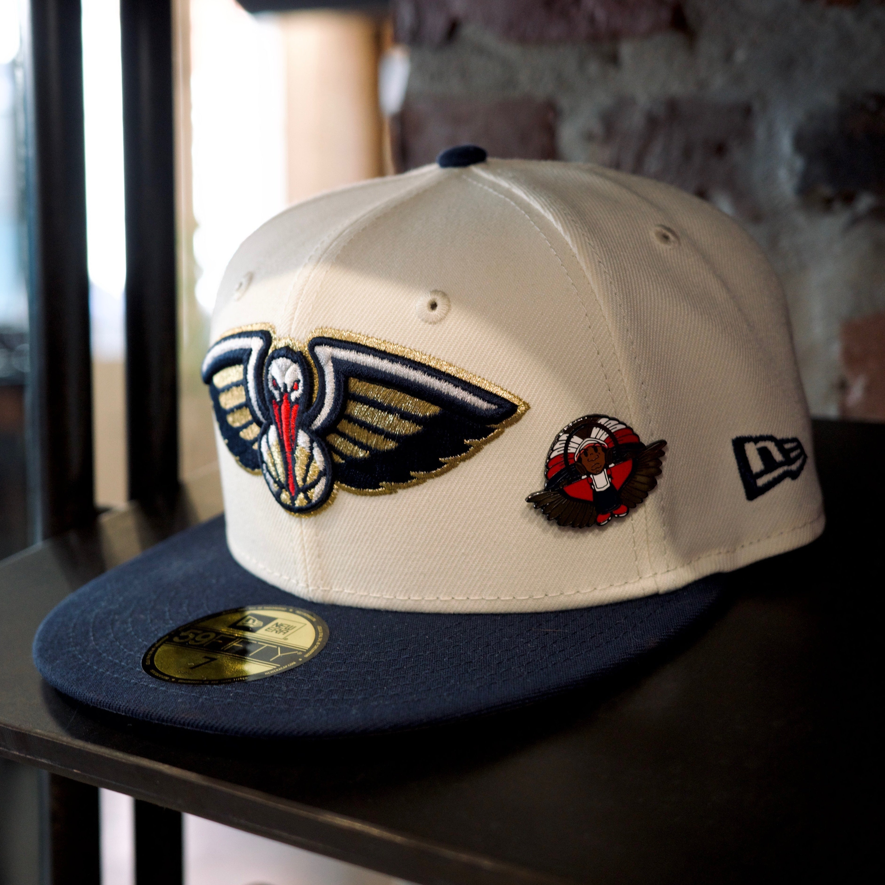 New Orleans Pelicans white and navy cap with embroidered logos and SPY BOY pins