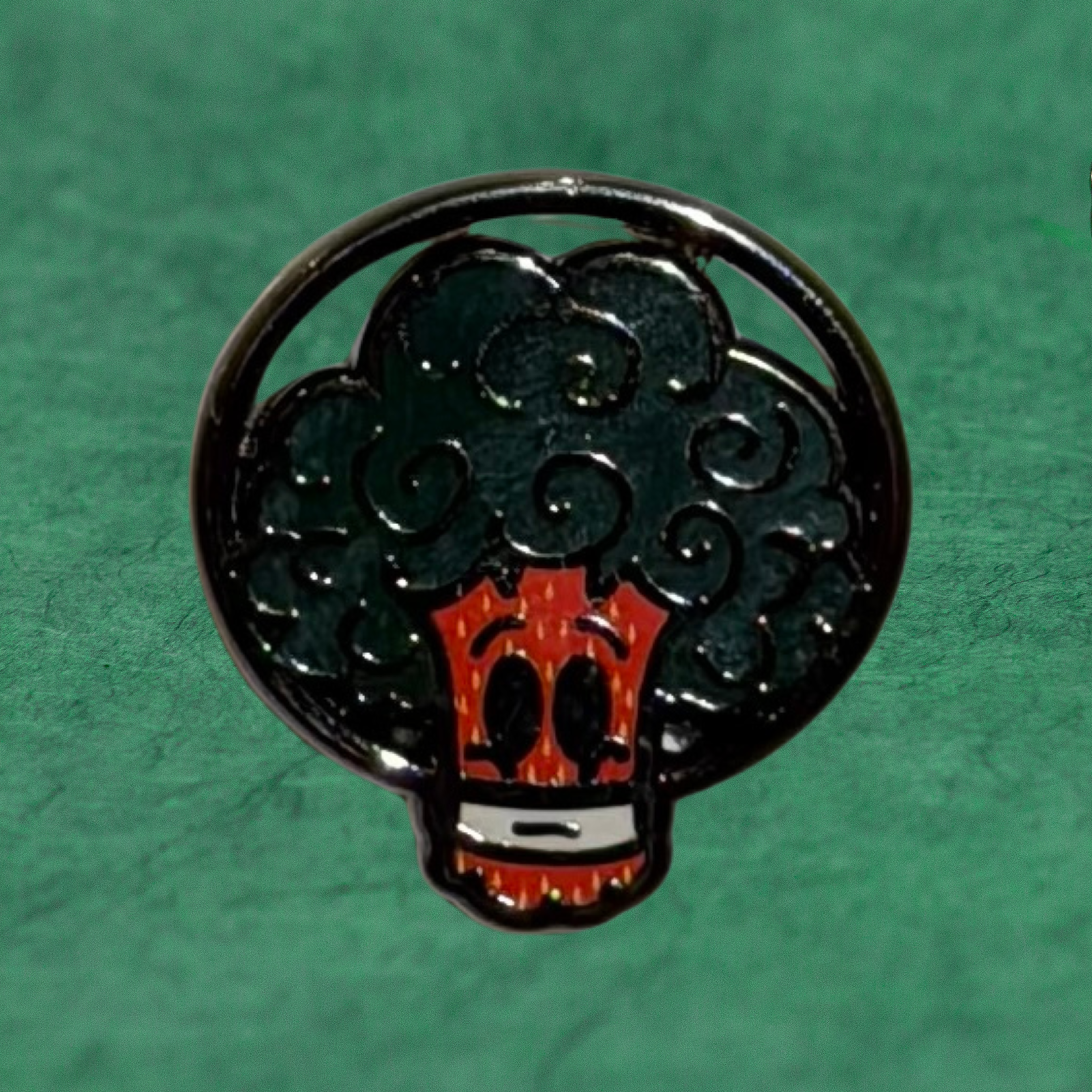 Space Broccoli strawberry pin by Compton III, a New Orleans artist